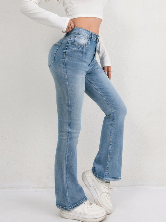 Light blue flared jeans are versatile and slimming for women.